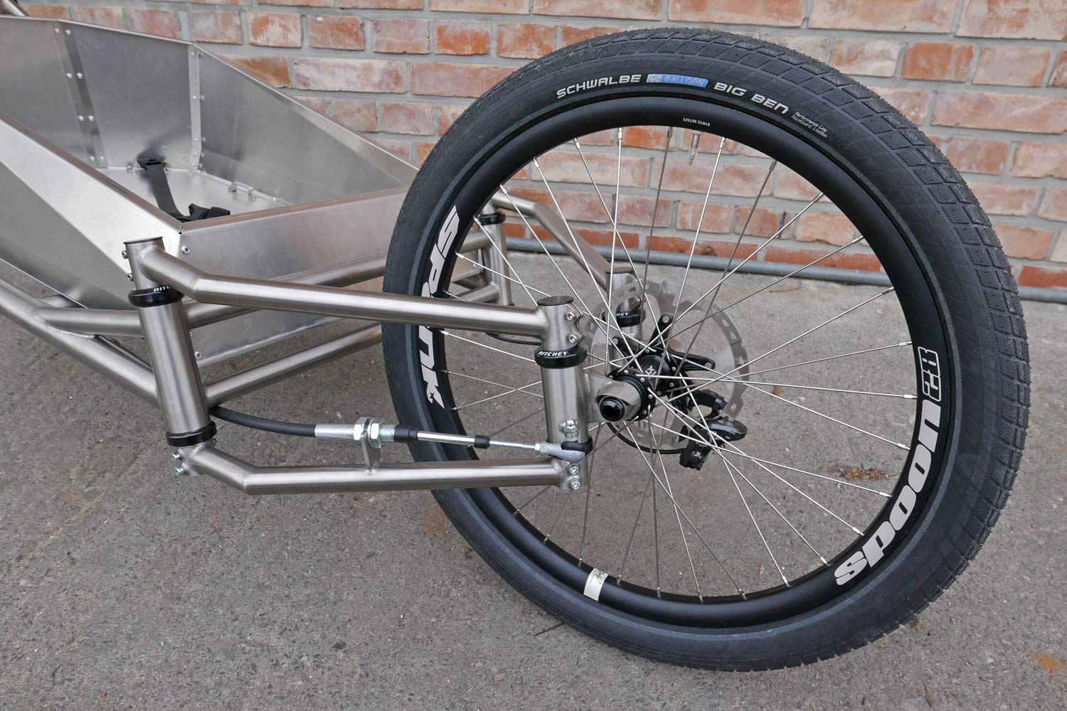 Catan-titanium-Cargobike_lightweight-mixed-surface-gravel-cargo-bike_unique-linkage-arm-steering_engineered-flex_front-end.jpg